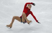 Russia's Yulia Lipnitskaya falls as she competes during the Figure Skating Women's free skating Program at the Sochi 2014 Winter Olympics, February 20, 2014. REUTERS/Issei Kato (RUSSIA - Tags: OLYMPICS SPORT FIGURE SKATING)