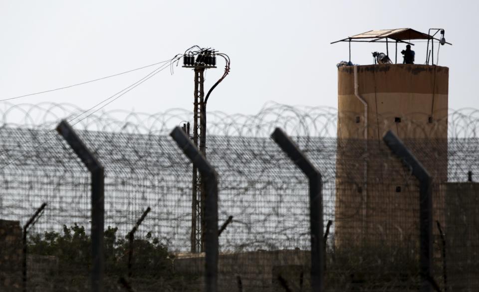 A member of Egypt's security forces stands on watchtower in North Sinai