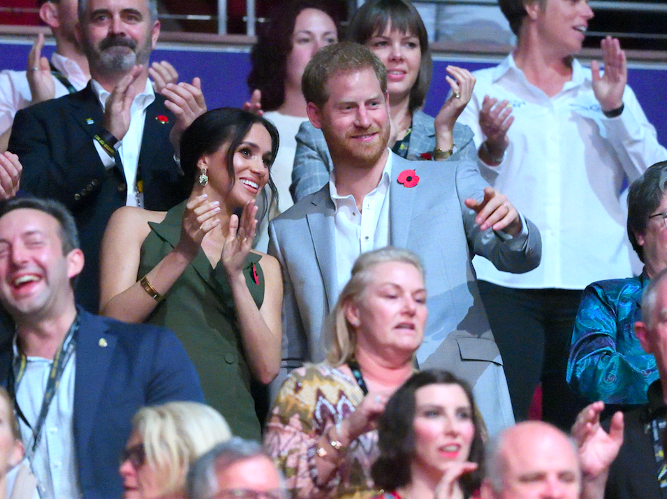 The Duchess and Duke of Sussex clap during the closing ceremony for the Invictus Games in Sydney, Oct. 27, 2018. Photo: Getty