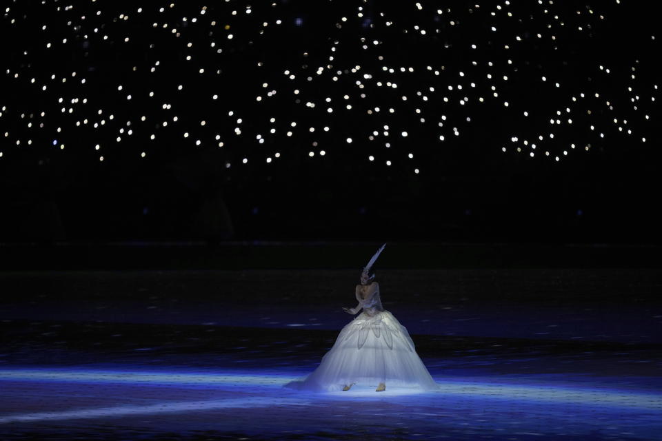 An artist performs during the opening ceremony of the 19th Asian Games in Hangzhou, China, Saturday, Sept. 23, 2023. (AP Photo/Dita Alangkara)