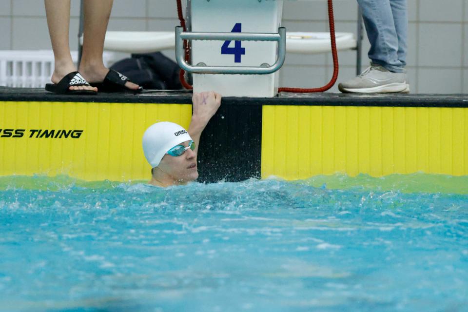 Norman's JD Thumann looks up at the leaderboard after winning the Class 6A title in the 100-yard butterfly at the state meet on Feb. 17 in Jenks.