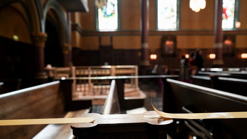 Some pews are taped off to preserve social distancing during Mass at the Cathedral of the Madeleine on Tuesday, May 12, 2020.