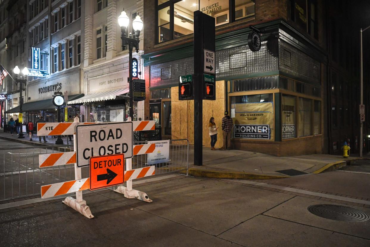 Vehicles traveling northbound on Gay Street are met with this "road closed" sign at the intersection of Union Avenue that directs motorists toward State Street Garage. Pedestrians are met with their own sign placed on the barricade that reads, "Enjoy this specially dedicated open space."