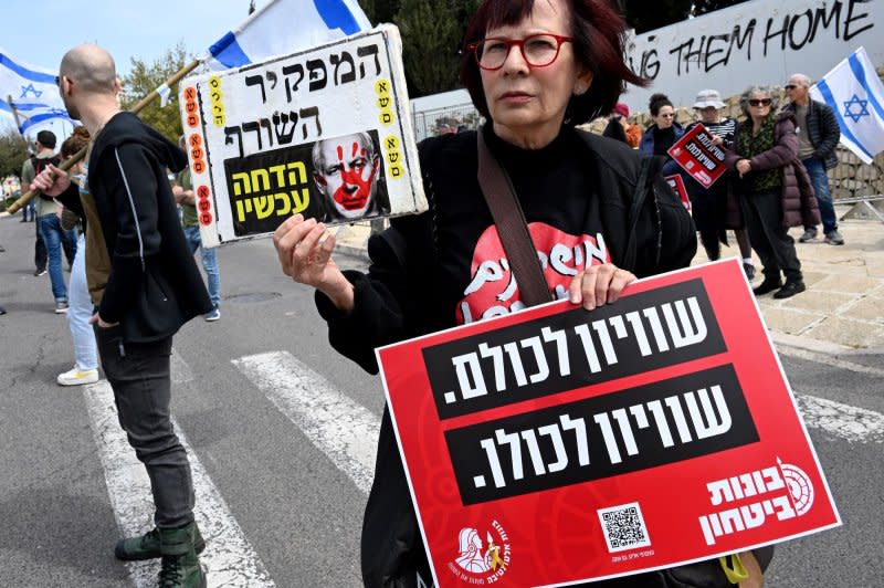 Israeli army reserve activists from Brother In Arms hold placards at a protest against military exemption for the Ultra-Orthodox, Haredim, outside Prime Minister Benjamin Netanyahu's office in Jerusalem on Tuesday. Photo by Debbie Hill/UPI