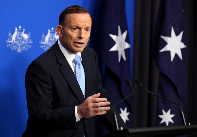 A picture released by the Australian Prime Minister's office on July 23, 2014 shows Prime Minister Tony Abbott speaking at a press conference in Canberra