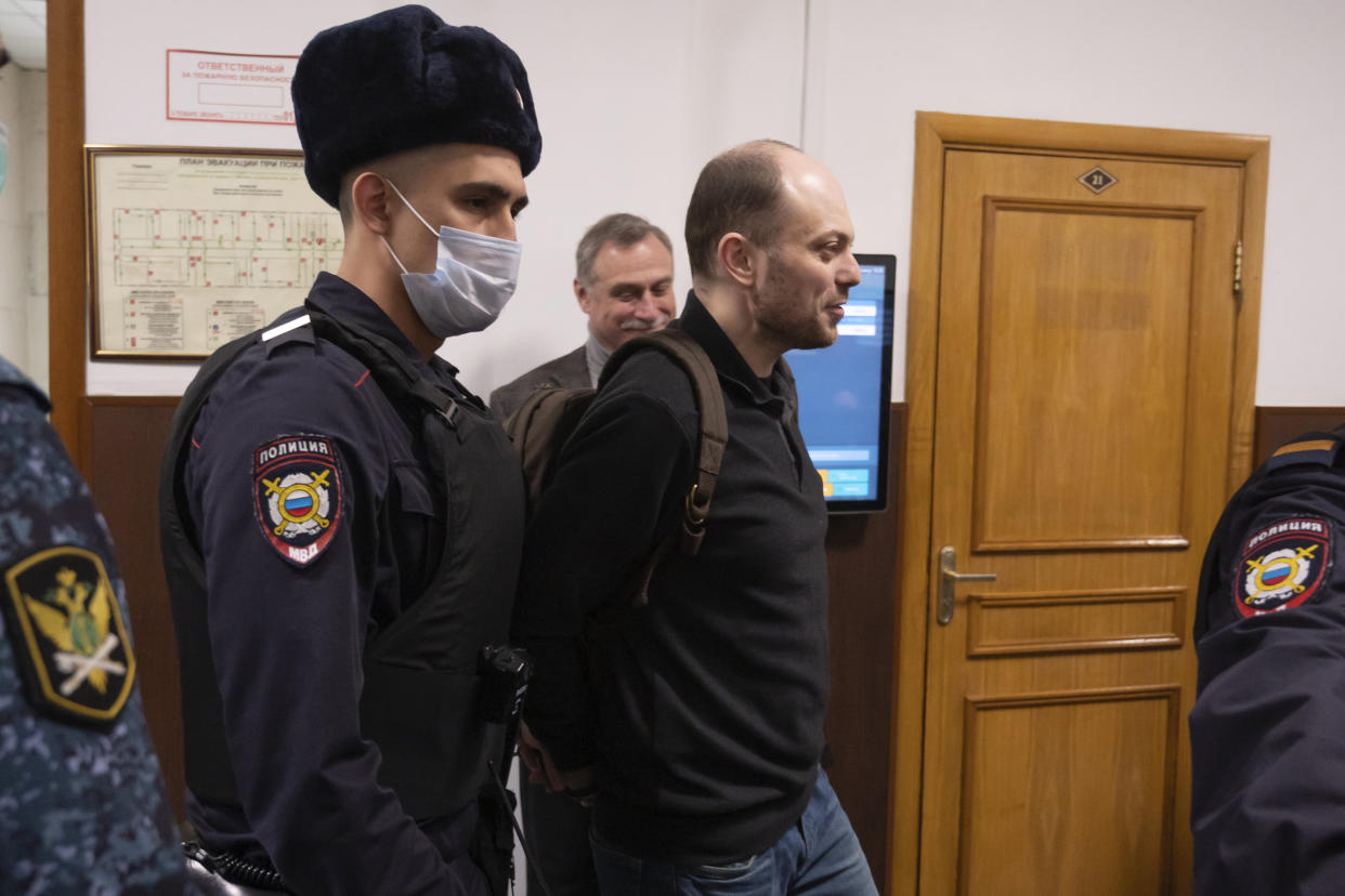 Russian opposition activist Vladimir Kara-Murza is escorted to a courtroom for a hearing (Dmitry Serebryakov / AP file)