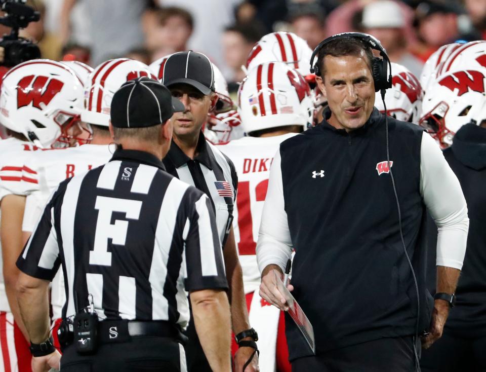 Wisconsin Badgers head coach Luke Fickell talks to an official during the NCAA football game against the Purdue Boilermakers, Friday, Sept. 22, 2023, at Ross-Ade Stadium in West Lafayette, Ind. Wisconsin Badgers won 38-17.