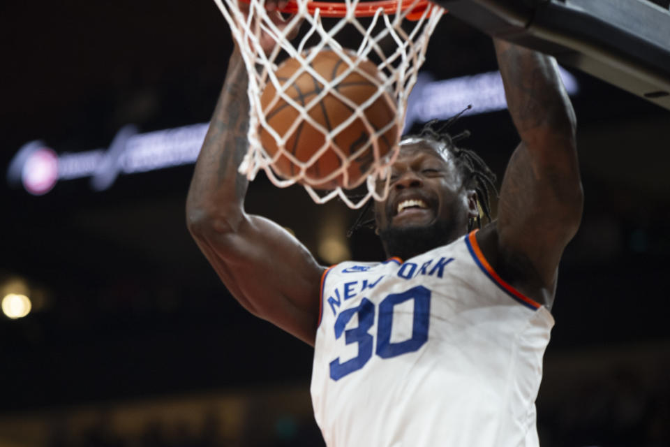 New York Knicks forward Julius Randle (30) dunks during the second half of an NBA basketball game against the Atlanta Hawks Saturday, Nov. 27, 2021, in Atlanta. (AP Photo/Hakim Wright Sr.)