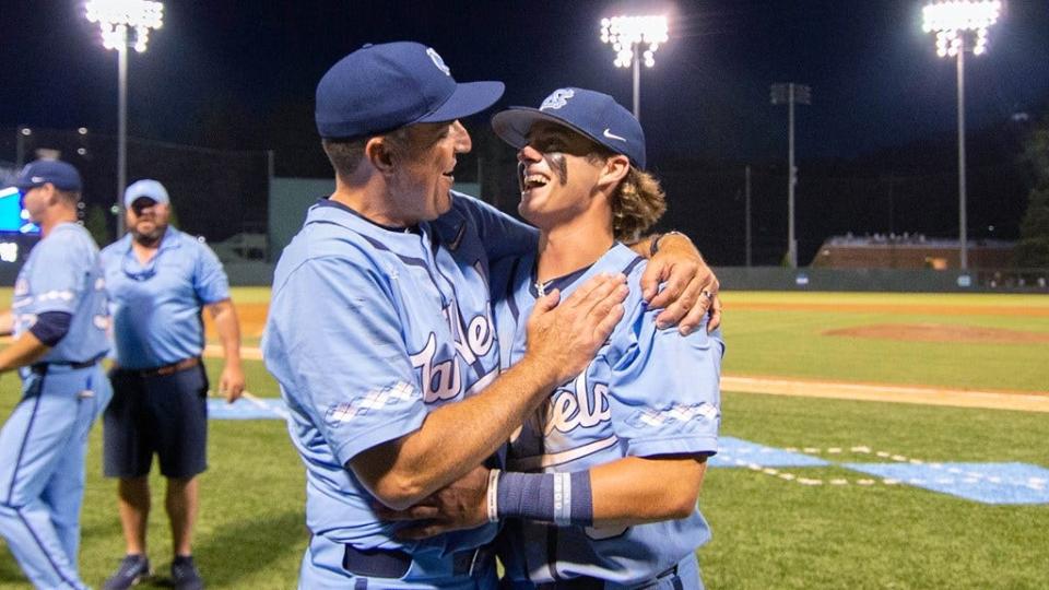 North Carolina coach Scott Forbes and second baseman Colby Wilkerson, right, hug after the Tar Heels defeated VCU to win the Chapel Hill Regional in the NCAA Tournament.