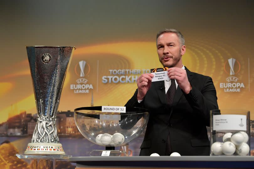 UEFA Europa League Ambassador Patrik Andersson draws out the name of Tottenham Hotspur