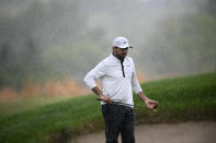 Jason Day of, Australia, line up a shot in the rain on the 16th hole during the second round of the Wells Fargo Championship golf tournament, Friday, May 6, 2022, at TPC Potomac at Avenel Farm golf club in Potomac, Md. (AP Photo/Nick Wass)