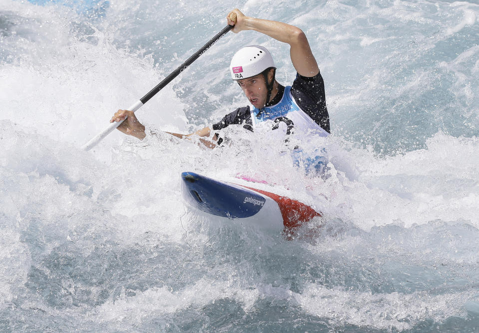 FILE - Tony Estanguet of France competes in the heats of the C-1 men's canoe slalom at Lee Valley Whitewater Center, at the 2012 Summer Olympics, Sunday, July 29, 2012, in London. Estanguet who won gold medals for canoeing in the 2000, 2004 and 2012 Olympic Games is now the face and chief organizer of the 2024 Paris Games. In a wide-ranging interview with The Associated Press, Estanguet talks about the two French police probes into Olympic-related contracts, and insists they bear no comparison with corruption and ethics scandals that have dogged the Olympic movement and its flagship money-spinning event for decades. (AP Photo/Kirsty Wigglesworth, File)