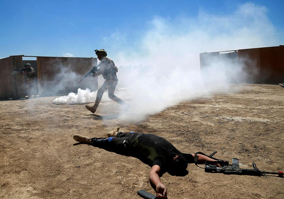 Australian and New Zealand coalition forces participate in a training mission with Iraqi army soldiers at Taji Base, north of Baghdad, Iraq, Wednesday, April 17, 2019. A month after the defeat of the Islamic State group in Syria and Iraq, the U.S.-led international coalition has turned its attention to training Iraqi forces to secure the country against lingering threats posed by IS cells operating in the countryside. (AP Photo/Hadi Mizban)