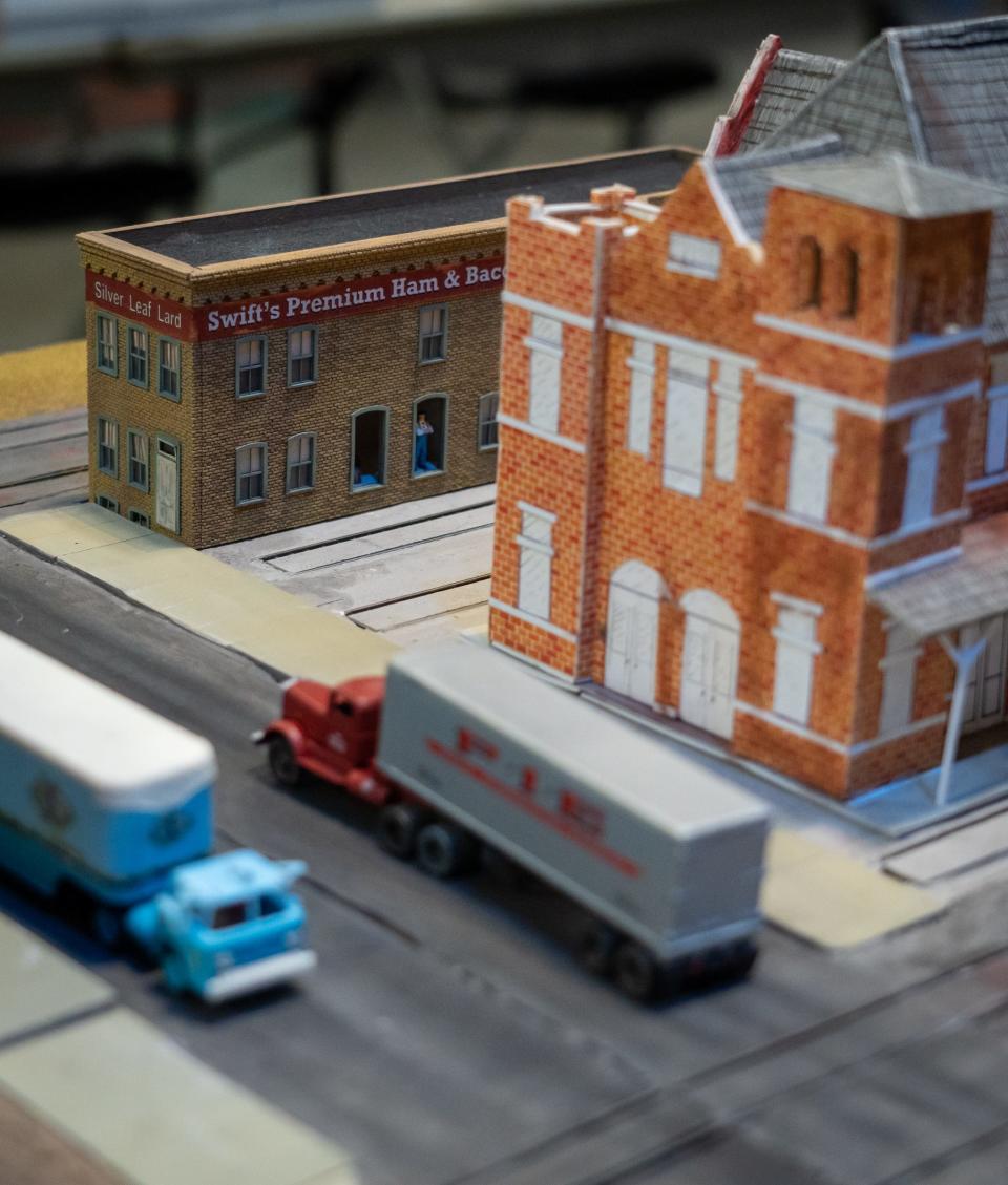 The Austin Model Railroad Society's model railway features historically accurate buildings from downtown Austin and the surrounding area, including the Swift's Premium Ham and Bacon building while on display at the Austin 2023 Train Show in the Palmer Events Center. The building, near the corner of 3rd Street and Congress Avenue, is currently home to The Elephant Room and Swift's Attic.