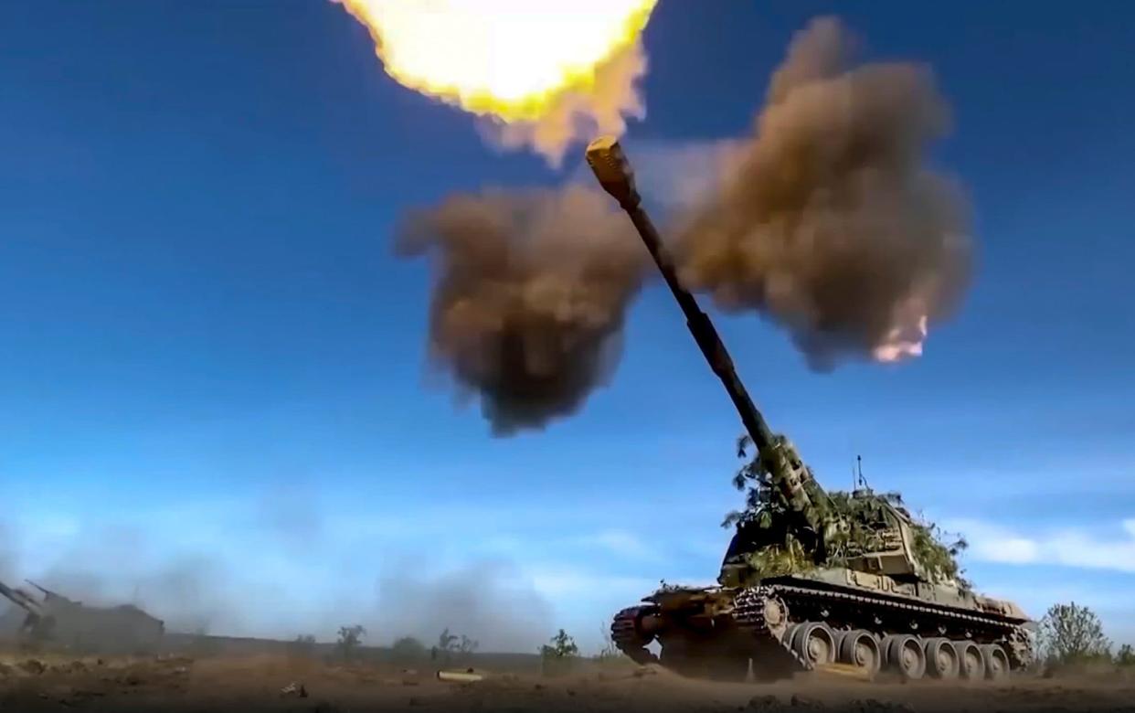 A Russian tank fires towards Ukrainian positions in footage released on Monday