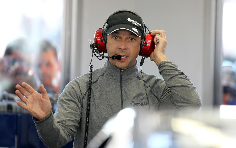 Crew chief Chad Knaus talks with driver Jimmie Johnson during NASCAR Sprint Cup auto racing practice on Friday, March 7, 2014, in Las Vegas. (AP Photo/Isaac Brekken)