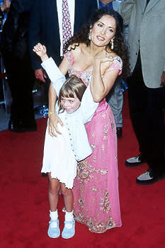 Salma Hayek begins to wrestle a young child (who happens to be Chloe Sonnenfeld) at the LA premiere for Wild Wild West Photo by Jeff Vespa