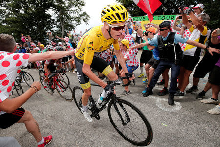 Team Sky rider and yellow jersey Chris Froome of Britain in action in Stage 9. REUTERS/Benoit Tessier