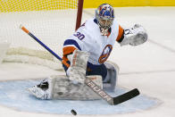 New York Islanders goaltender Ilya Sorokin (30) defends against a shot during the first period of an NHL hockey game against the New Jersey Devils, Sunday, Jan. 24, 2021, in Newark, N.J. (AP Photo/Kathy Willens)