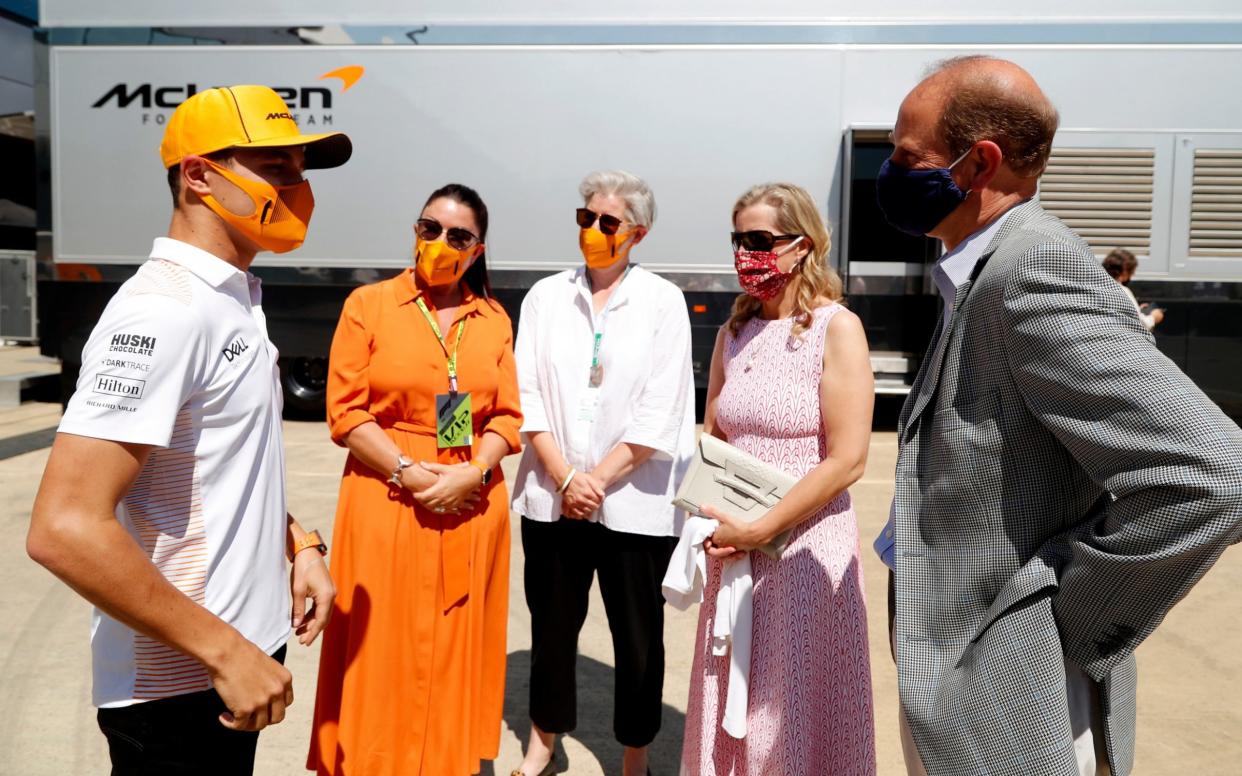 NORTHAMPTON, ENGLAND - JULY 18: Prince Edward, Earl of Wessex and Sophie, Countess of Wessex speak with Lando Norris (left) during a visit to the McLaren team garage at the British Grand Prix in Silverstone on July 18, 2021 in Northampton, England. Before the start of the race at Silverstone, Edward and Sophie met McLaren drivers Lando Norris and Daniel Ricciardo and their team which is joining forces with the DofE to encourage the public to take part in the charity's new fundraising challenge Do It 4 Youth. - Getty Images