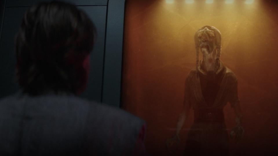 Obi-Wan Kenobi looks at a Jedi entombed at Fortress Inquisitorious