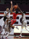 Radford's Fah'Mir Ali (0), surrounded by Virginia Tech defenders Cartier Diarra (2) Cordell Pemsl (35) and Joseph "Joe" Bamisile (1) tries to shoot during the second half of an NCAA college basketball game, Wednesday Nov. 25, 2020, in Blacksburg Va. (Matt Gentry/The Roanoke Times via AP)