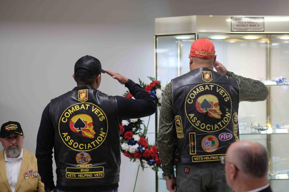 Two members of the Combat Veterans Association salute during the Veterans Day Ceremony  Friday at the Texas Panhandle War Memorial Center.