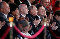 Russian President Vladimir Putin (5th L), FIFA President Gianni Infantino (4th L) and Bolivian President Evo Morales (2nd L) attend a gala concert, dedicated to the upcoming 2018 FIFA World Cup, in Red Square in Moscow, Russia June 13, 2018. Sergei Chirikov/Pool via REUTERS