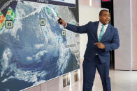 Co-anchor and meteorologist Jason Frazer rehearses on the Fox Weather set at News Corporation headquarters in New York, Wednesday, Oct. 20, 2021. Fox Weather, a free streaming service and app, will launch on Monday. (AP Photo/Richard Drew)