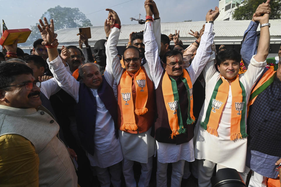 Chief Minister Shivraj Singh Chouhan, center, poses for media with other leaders following Bharatiya Janata Party's lead in the Madhya Pradesh state elections in Bhopal, India, Sunday, Dec.3 2023. (AP Photo/Abdul Mujeeb Faruqui)