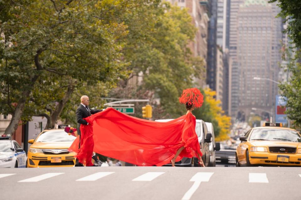 Lisa Todd-Wexley (Nicole Ari Parker) crossing the street in couture Valentino, with husband Herbert Wexley (Chris Jackson) holding her train. 