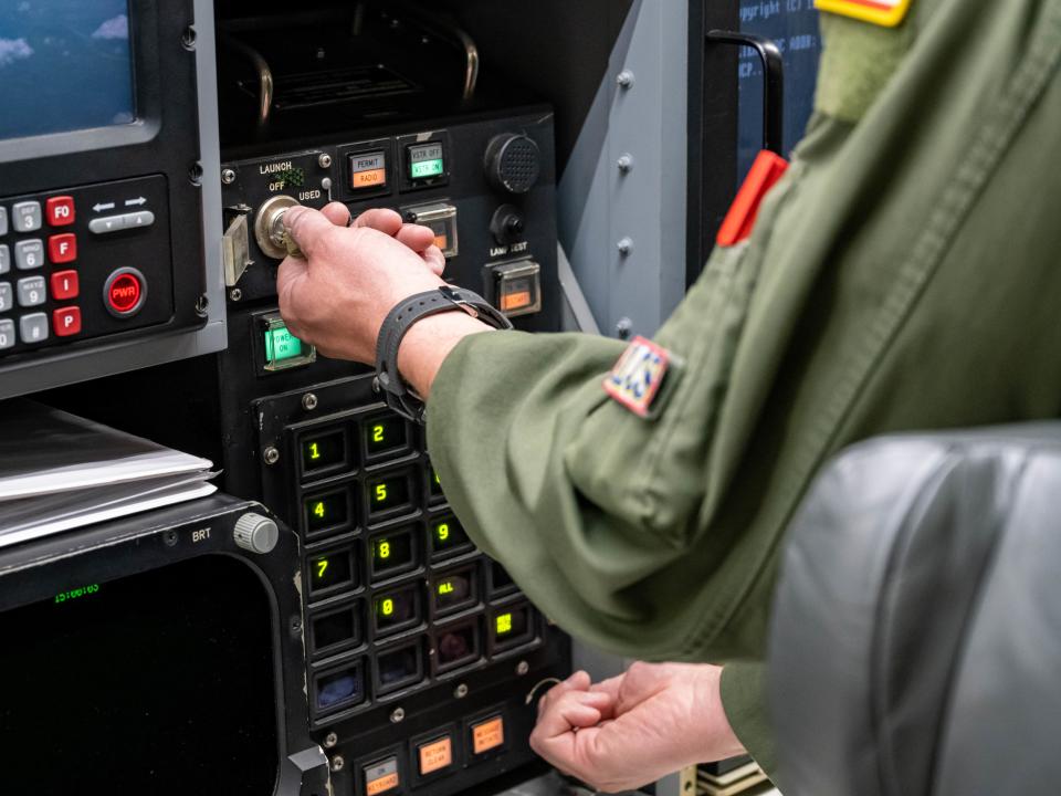 US Air Force Maj. Hayden McVeigh, 625th Strategic Operations Squadron deputy missile combat crew commander-airborne, turns the keys to initiate the launch of an unarmed Intercontinental Ballistic Missile during an Operational Test Launch out of Vandenberg Space Force Base, April 19, 2023