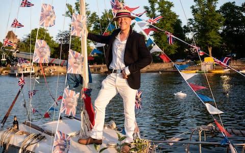 Tom Nicholson, from Surrey, enjoy the post wedding celebrations in Windsor on his boat 'Jarni'. - Credit: John Nguyen for The Telegraph