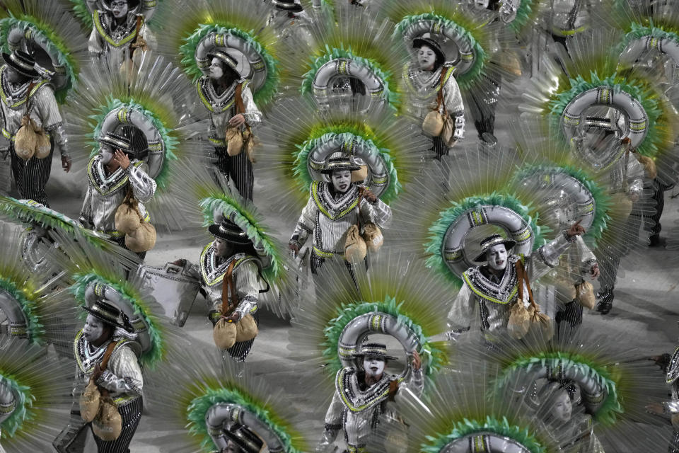 Performers from the Beija Flor samba school parade during Carnival celebrations at the Sambadrome in Rio de Janeiro, Brazil, Tuesday, Feb. 21, 2023. (AP Photo/Silvia Izquierdo)