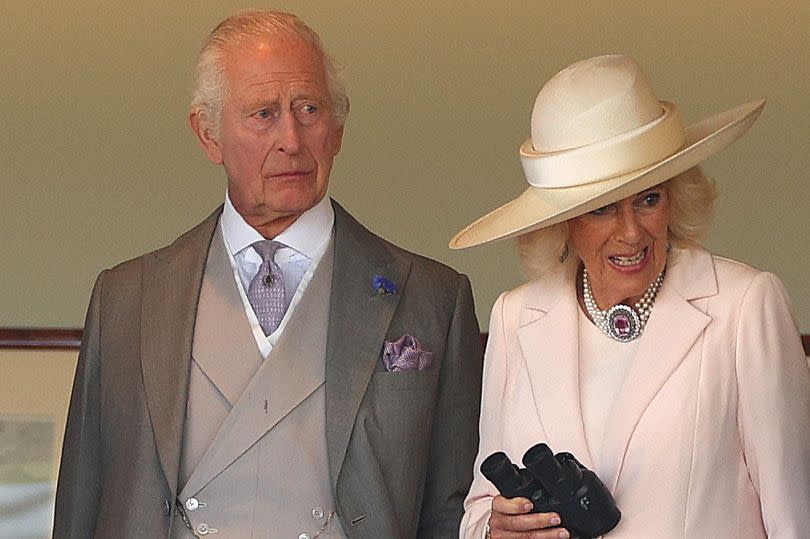 King Charles III and Queen Camilla watch from the Royal Box during Day Five of Royal Ascot