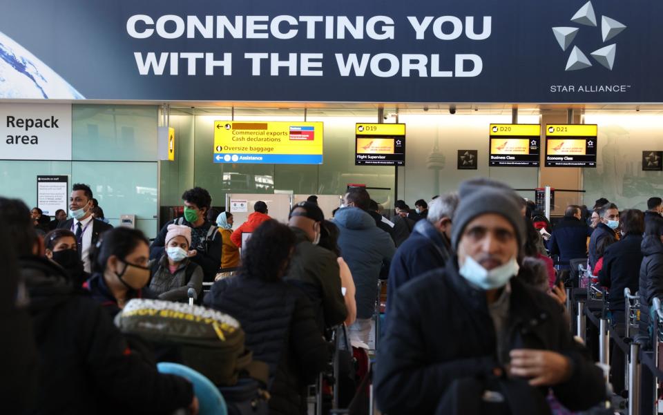 Travellers line up at Heathrow Terminal 2 - Hollie Adams/Getty Images