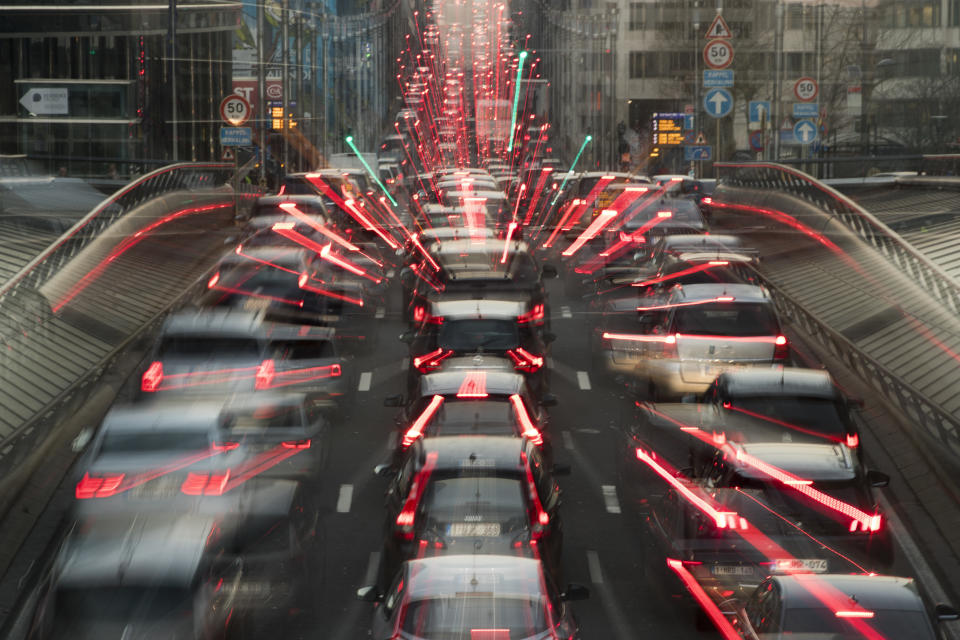 In this slow-shutter zoom effect photo taken on Wednesday, Dec. 12, 2018, commuters backed up in traffic during the morning rush hour, in Brussels, a city that regularly experiences pollution alert warnings. As politicians haggle at a U.N. climate conference in Poland over ways to limit global warming, the industries and machines powering our modern world keep spewing their pollution into the air and water. The fossil fuels extracted from beneath the earth’s crust _ coal, oil and gas _ are transformed into the carbon dioxide that is now heating the earth faster than scientists had expected even a few years ago. (AP Photo/Francisco Seco, File)