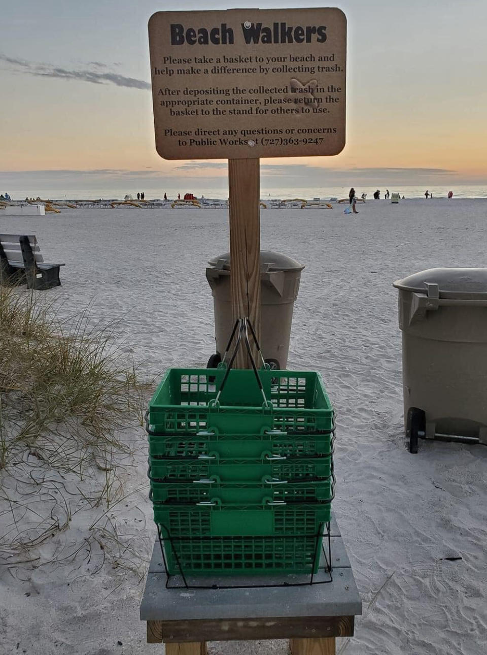 Supermarket baskets placed at the beach to ask volunteers to help clean up the area