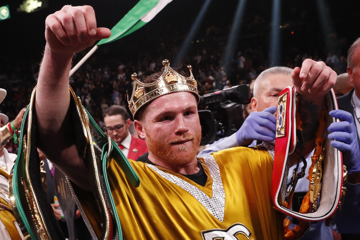 Canelo Alvarez, of Mexico, celebrates after defeating Caleb Plant in a super middleweight title unification fight Saturday, Nov. 6, 2021, in Las Vegas. (AP Photo/Steve Marcus)
