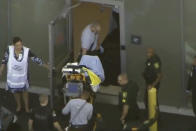 <p>A man placed in handcuffs by police is wheeled on a stretcher into a hospital near Marjory Stoneman Douglas High School following a shooting incident in Parkland, Fla. on Feb. 14, 2018 in a still image taken from a video. (Photo: WSVN.com via Reuters) </p>