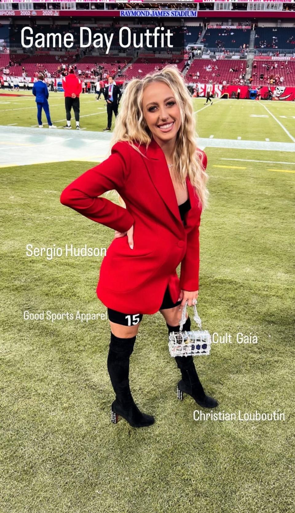 Brittany Mahomes styles spiked Louboutins with red blazer on the sidelines. - Credit: via Instagram