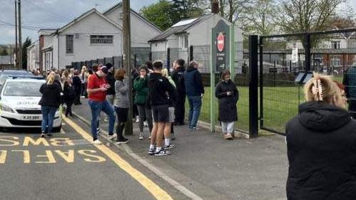 Parents outside Ysgol Dyffryn Aman