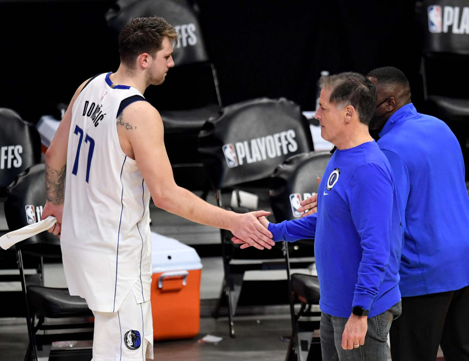 Los Angeles, CA - June 06:  Dallas Mavericks owner Mark Cuban shakes hands with Luka Doncic #77 of the Dallas Mavericks after defeating the Dallas Mavericks 126-111 during game seven of the Western Conference First Round NBA Playoff basketball game at the Staples Center in Los Angeles on Sunday, June 6, 2021. LA Clippers won 126-111 to advance to the second round. (Photo by Keith Birmingham/MediaNews Group/Pasadena Star-News via Getty Images)