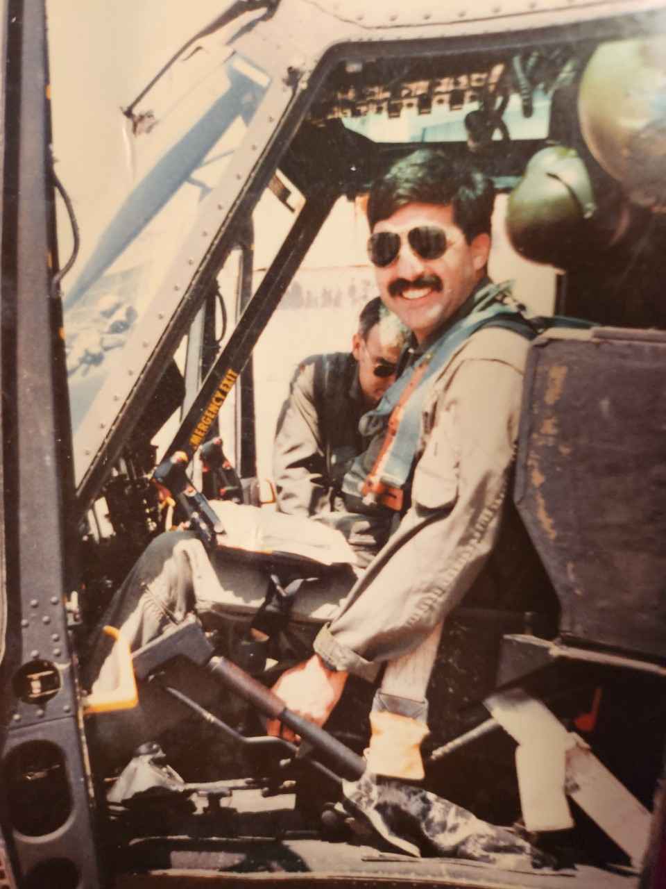 Peter Tokarz in the cockpit of an Army helicopter in 1983.