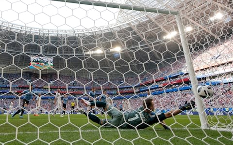  Igor Akinfeev of Russia dives but is beaten by a shot from Diego Laxalt of Uruguay (not pictured) for the second goal during the 2018 FIFA World Cup Russia group A match between Uruguay and Russia at Samara Arena on June 25, 2018 in Samara, Russia - Credit: Getty Images 