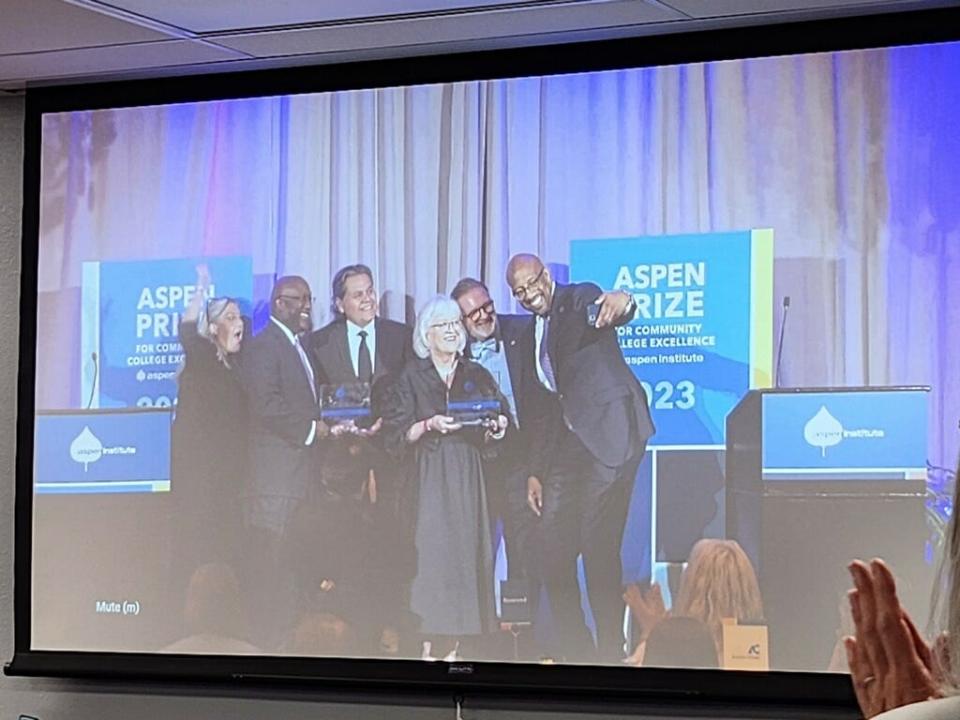 Members of Amarillo College (AC) and the community celebrate the college's being named one of two winners of the 2023 Aspen Prize as the ceremony in Washington, D.C., is live streamed Thursday on the AC campus. AC President Russell Lowery-Hart (second from right) joins others on the stage after the announcement.