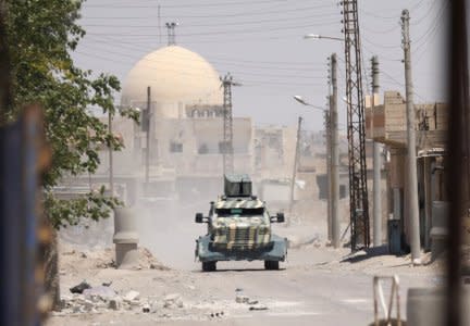 A military vehicle of SDF in west of Raqqa province,Syria June 18, 2017.REUTERS/ Rodi Said