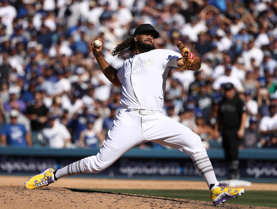 LOS ANGELES, CALIFORNIA - AUGUST 24: Closing pitcher Kenley Jansen #74 of the Los Angeles Dodgers pitches in the ninth inning of the MLB game between the New York Yankees and the Los Angeles Dodgers at Dodger Stadium on August 24, 2019 in Los Angeles, California. Teams are wearing special color-schemed uniforms with players choosing nicknames to display for Players' Weekend. (Photo by Victor Decolongon/Getty Images)