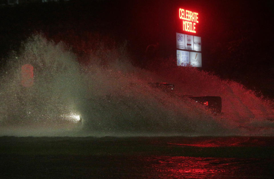 <p>A large truck drives through a flooded Water St. in downtown Mobile, Ala., during Hurricane Nate, Sunday, Oct. 8, 2017, in Mobile, Ala. Hurricane Nate came ashore along Mississippi’s coast outside Biloxi early Sunday, the first hurricane to make landfall in the state since Hurricane Katrina in 2005. (Photo: Brynn Anderson/AP) </p>
