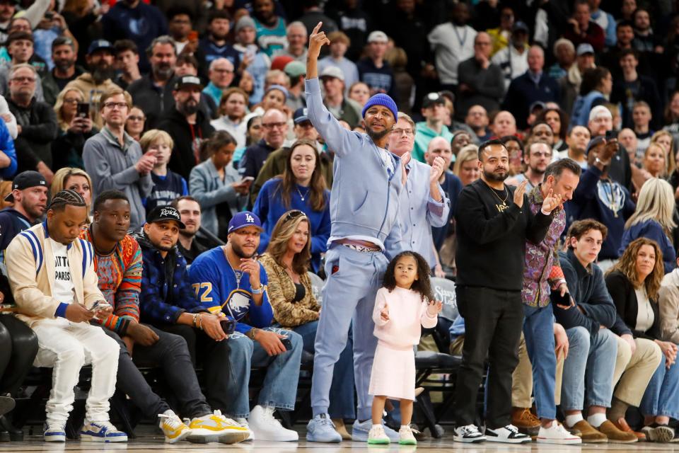 Tee and Kaari Morant, Ja Morant’s father and daughter, cheer in the final minutes of the game between the Indiana Pacers and Memphis Grizzlies at FedExForum in Memphis, Tenn., on Thursday, December 21, 2023.